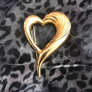 Gold heart pin.